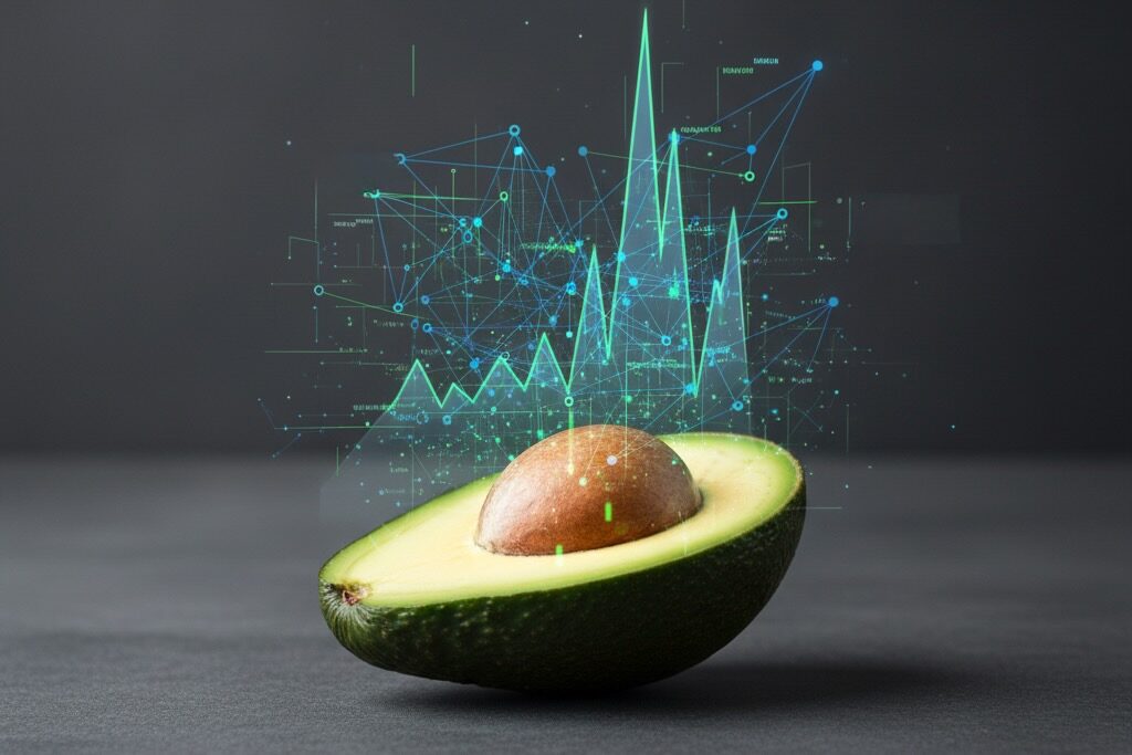 A halved avocado with its pit intact rests on a dark gray surface, with a holographic, digital data graph superimposed above it.